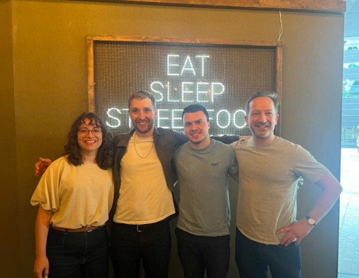 PGRs from the School of Music at the SysMus25 conference dinner (left to right: Bruna Martins, James Cannon, Rhun Gwiylm, Michael Solomon-Williams).